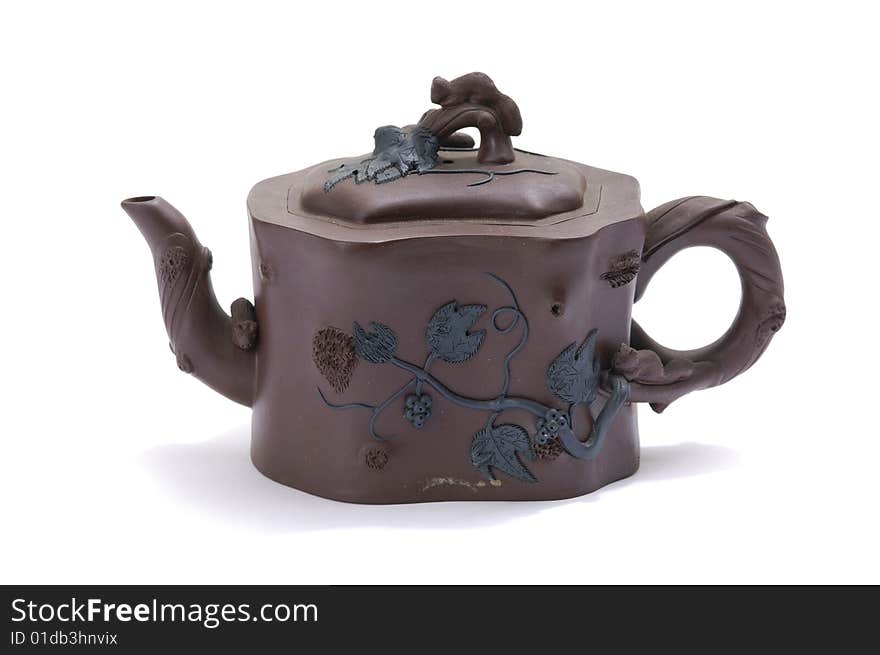 Isolated clay teapot on white background