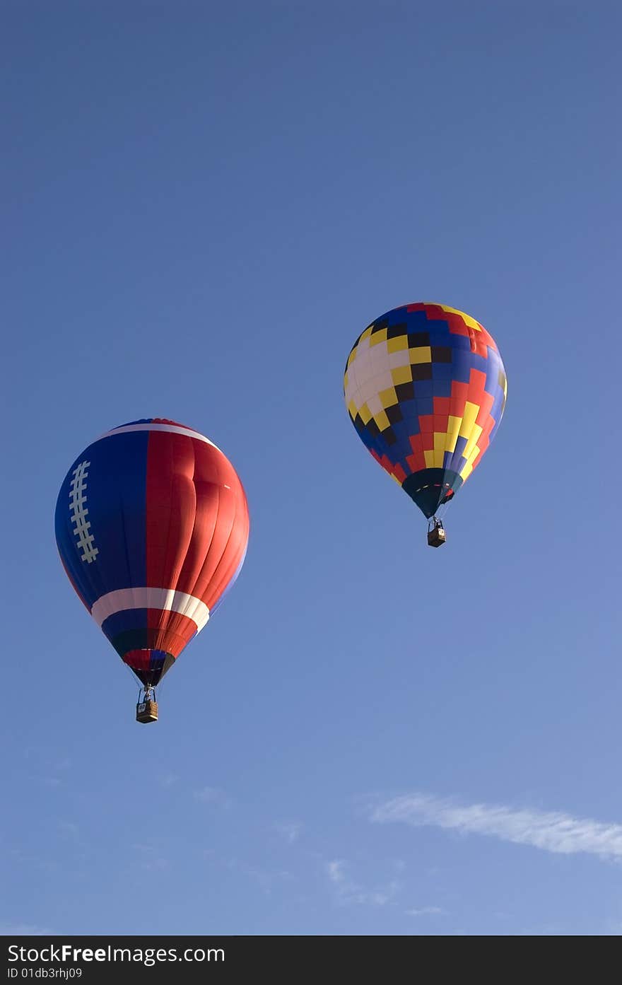 An image of a pair of hot air balloons. An image of a pair of hot air balloons