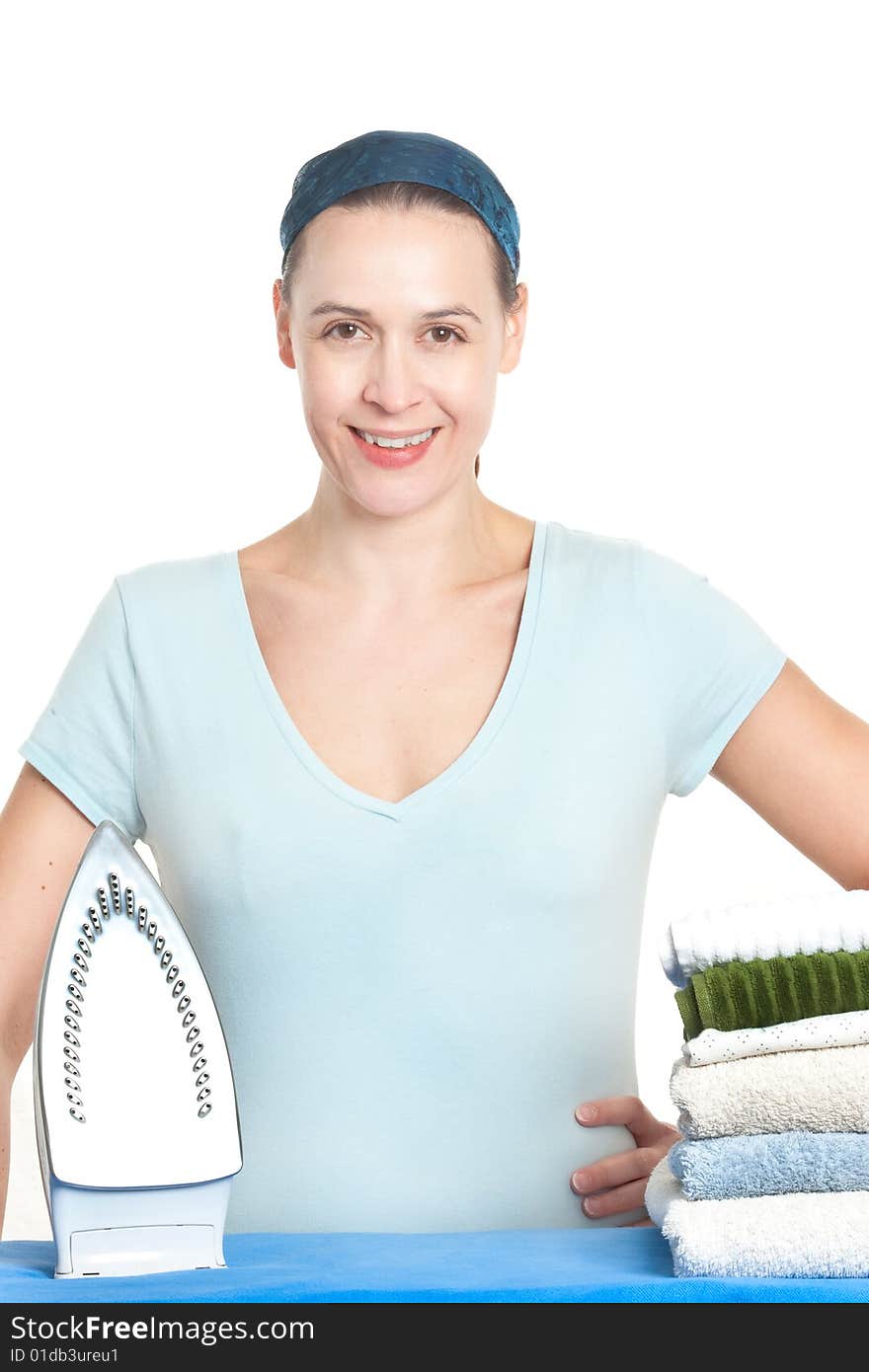 A woman in a domestic setting ready to tackle ironing on a white background. A woman in a domestic setting ready to tackle ironing on a white background