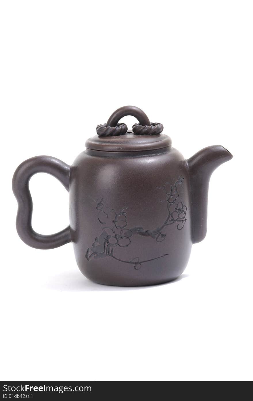 Isolated clay teapot on white background