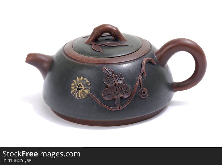 Isolated clay teapot on white background