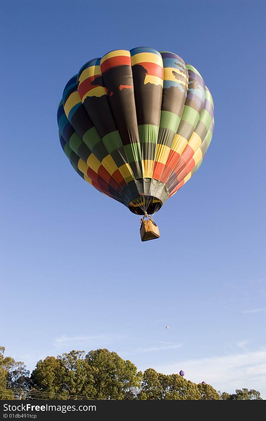 A shot of a hot air balloon rising. A shot of a hot air balloon rising