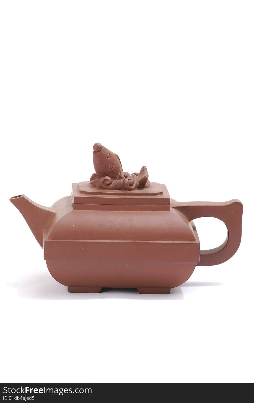 Isolated clay teapot on white background