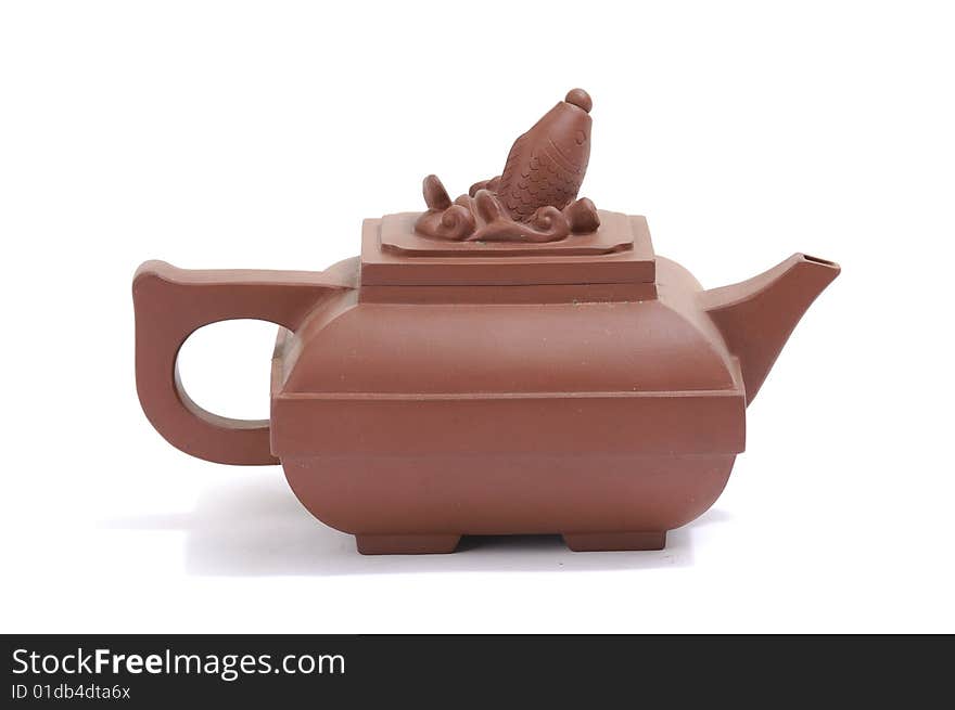 Isolated clay teapot on white background