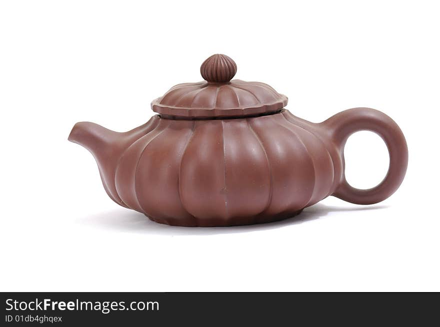 Isolated clay teapot on white background