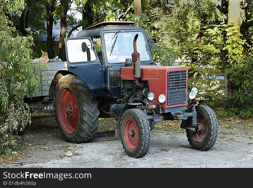 Tractor with garbage outdoor in the park