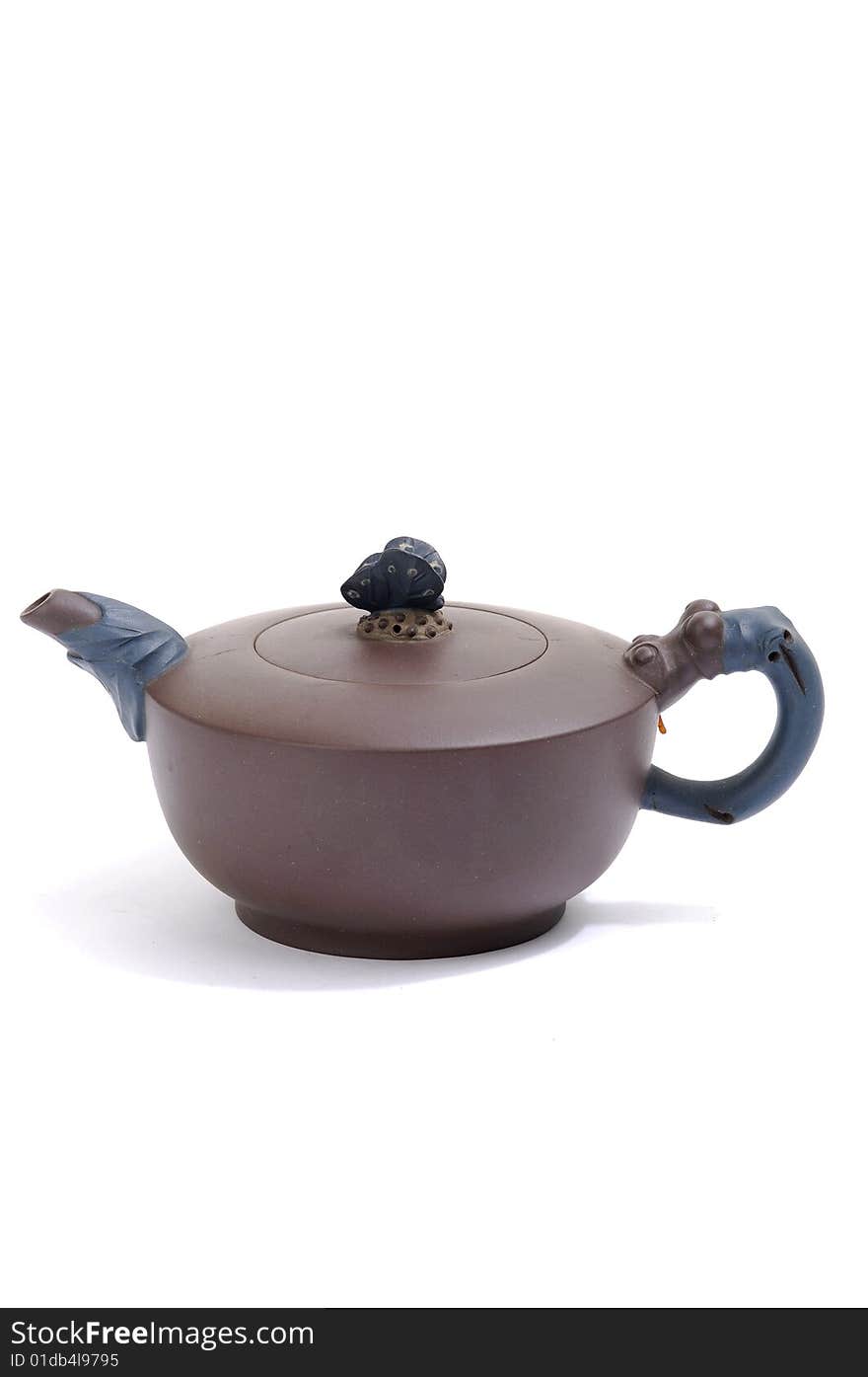 Isolated clay teapot on white background