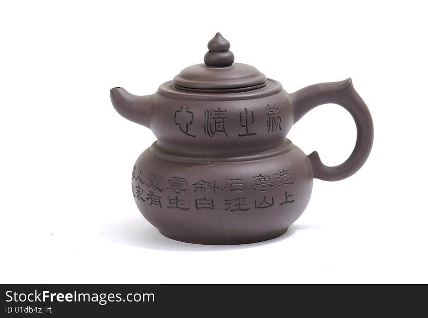 Isolated clay teapot on white background