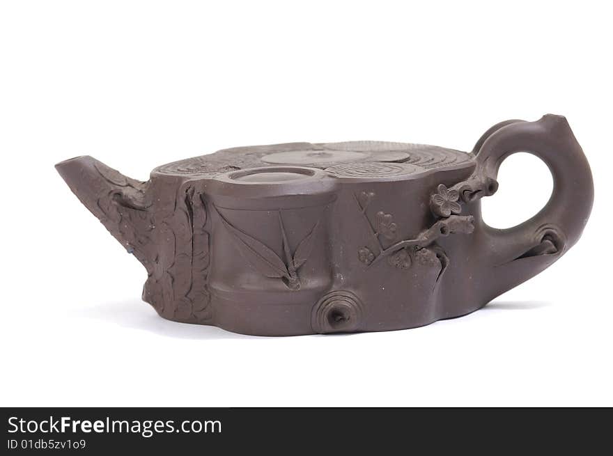 Isolated clay teapot on white background