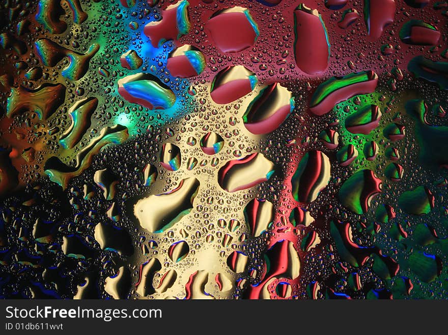 Multi-coloured drops of water. Multi-coloured drops of water