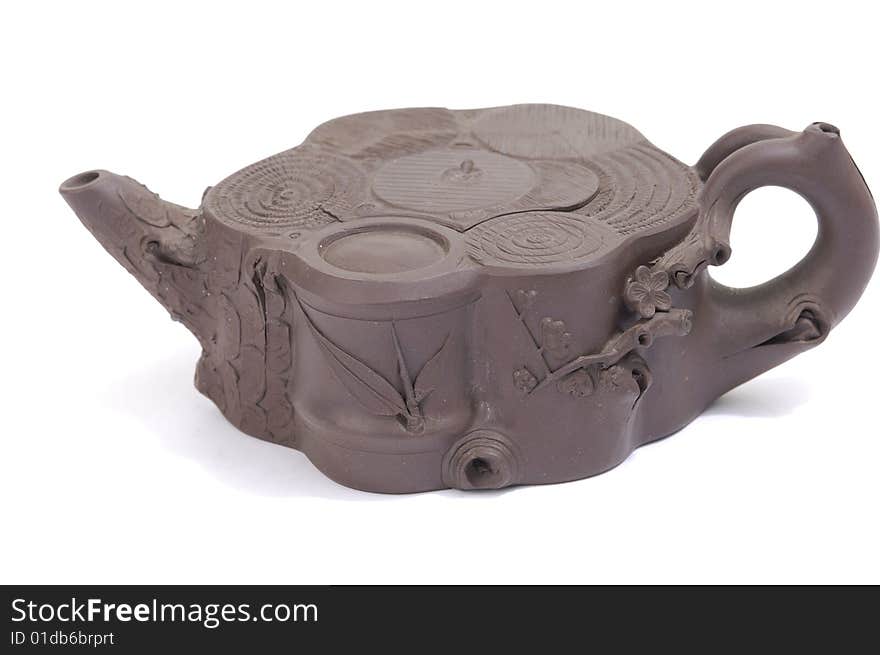 Isolated clay teapot on white background