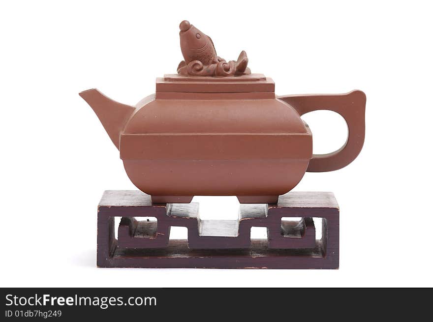 Isolated clay teapot on white background