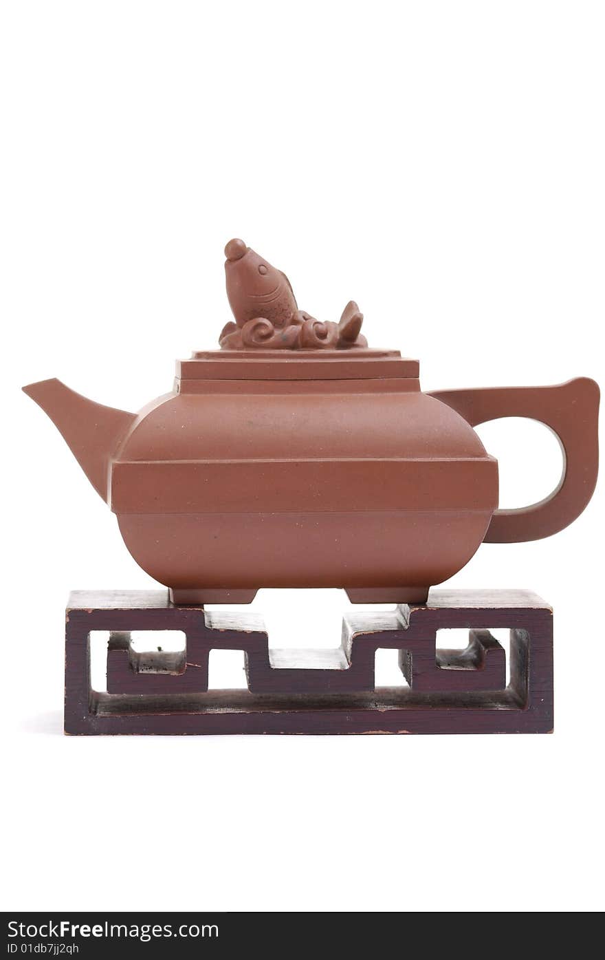 Isolated clay teapot on white background