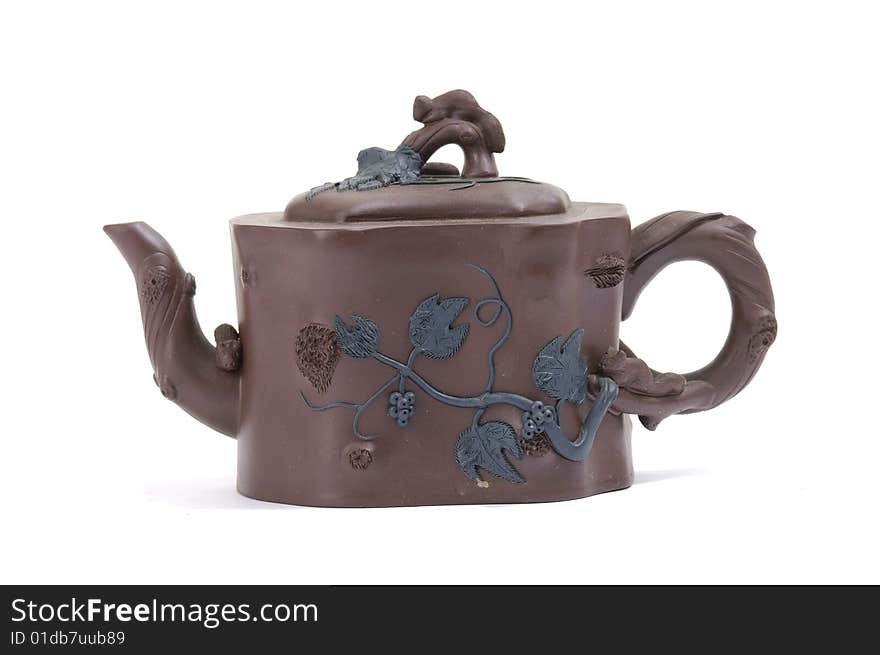 Isolated clay teapot on white background