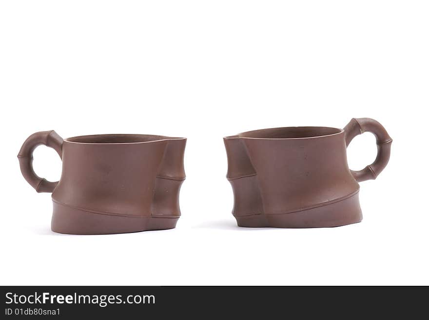 Isolated clay teapot on white background