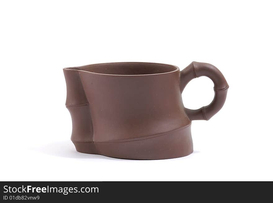 Isolated clay teapot on white background