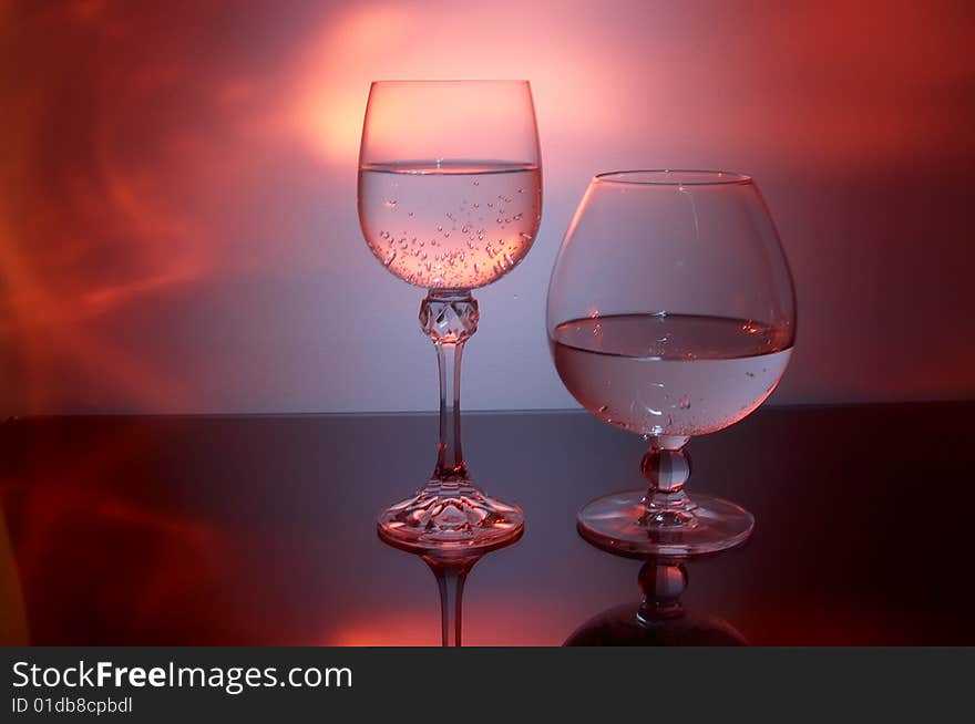 Wine glasses against abstraction background. Wine glasses against abstraction background.