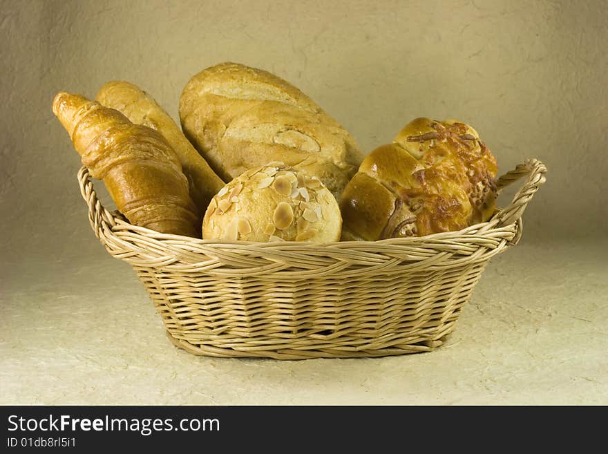 Bread, croissant, baguette on basket