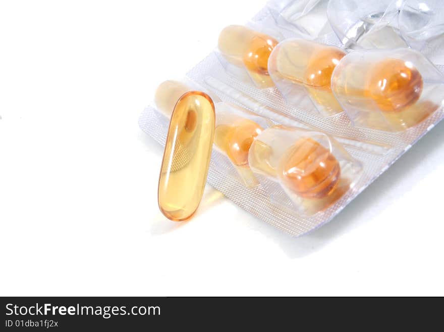 Some pills, capsules in package isolated on white. Bright, and clear.