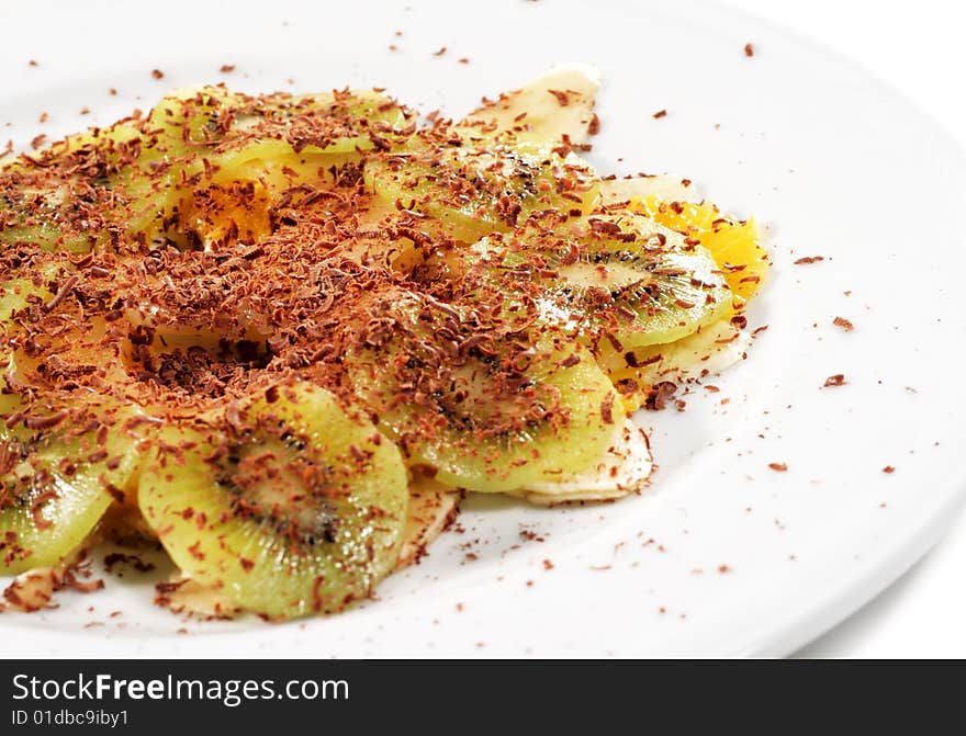 Fruit Carpaccio Plate under Chocolate Crumb. Isolated on White Background