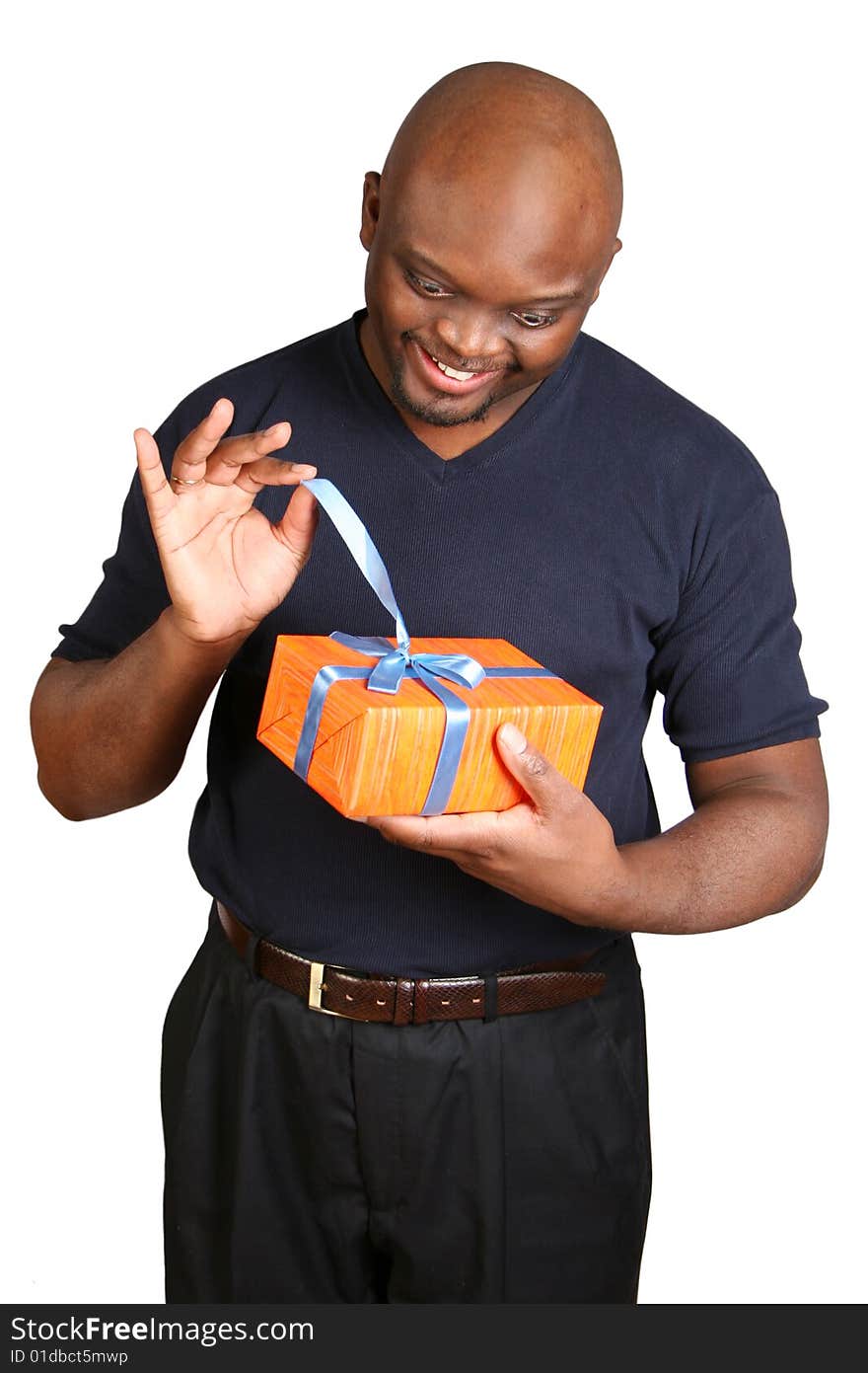 A young man holding a present. Isolated on white.