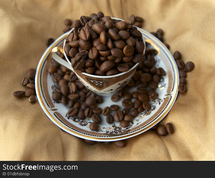 Cup Full Of Coffee Grains.