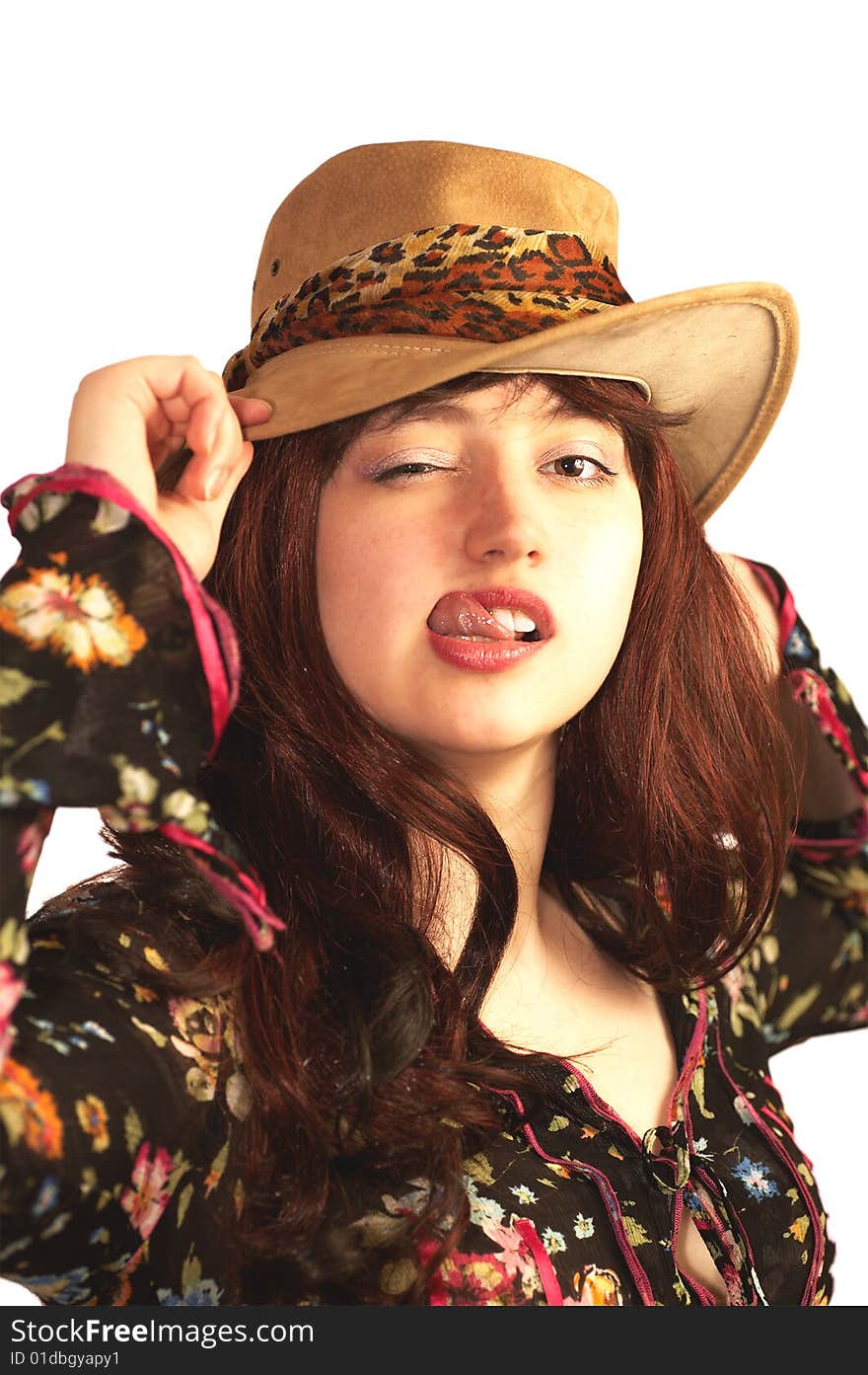 Young woman in hat winking, isolated on white