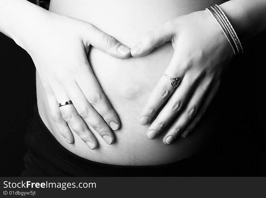 Hands of the pregnant woman on a stomach. Hands of the pregnant woman on a stomach