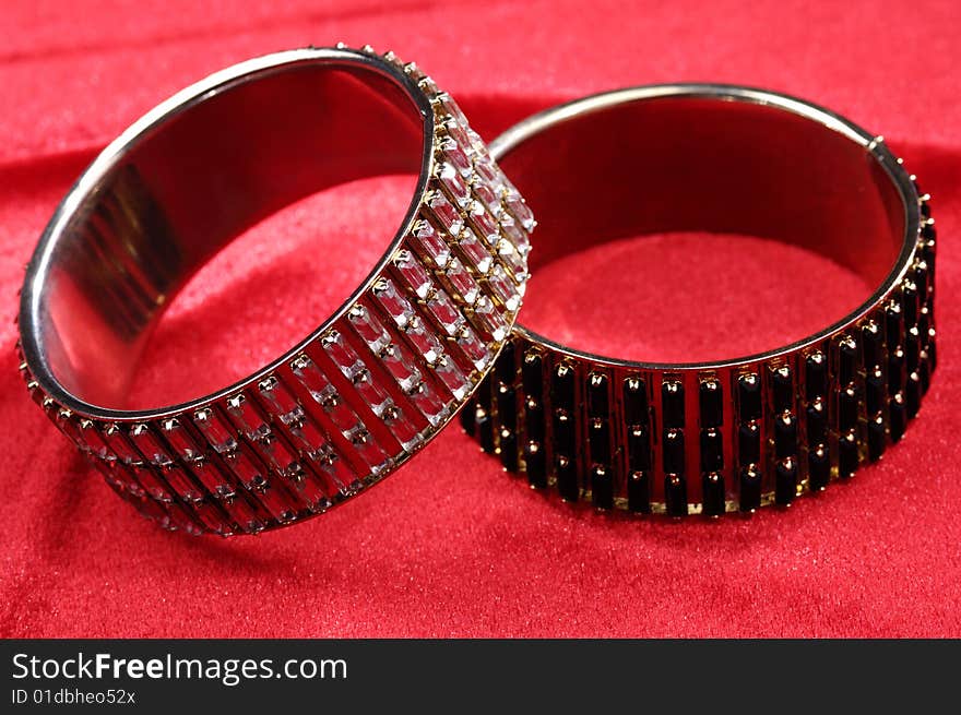 Fashion bracelets on red background