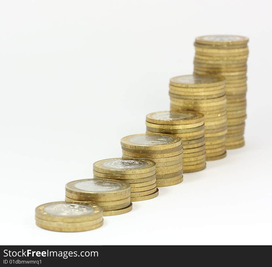 Columns of coins against white background