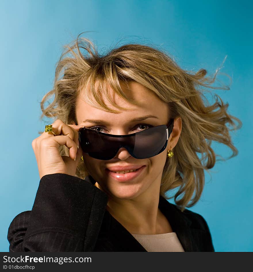 Portrait of attractive successful businesswoman over background