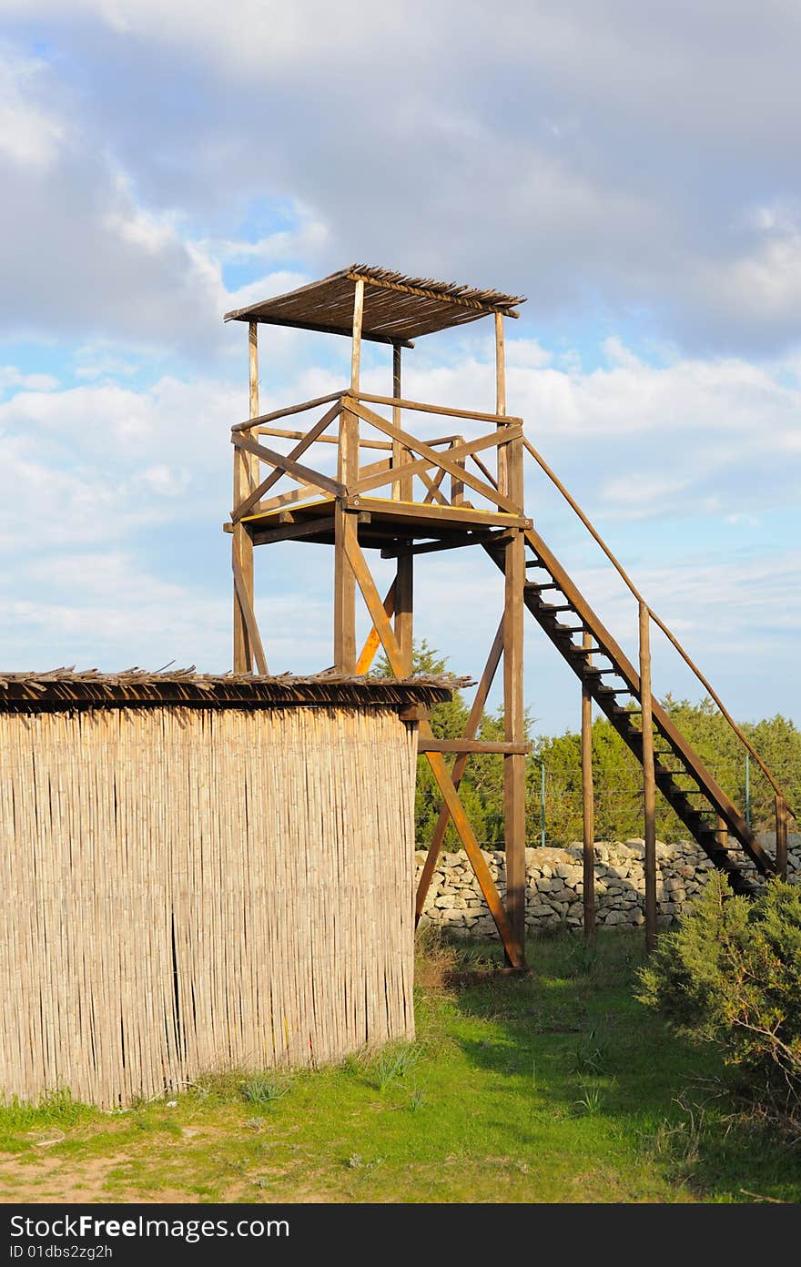 Watchtower in a natural park on cloudy sky