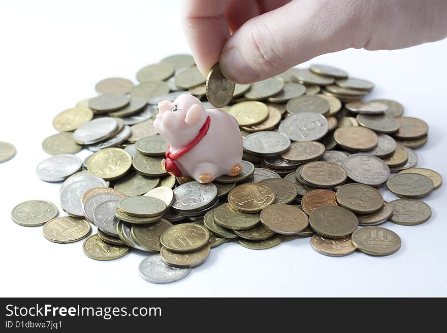 Businessman loading a piggy bank