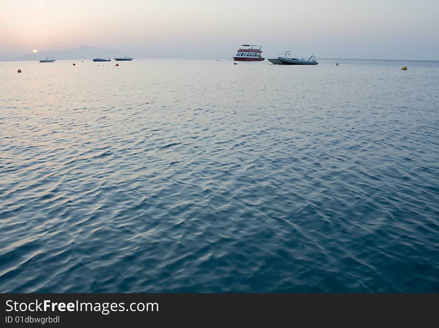 Sunrise And  Few Boats