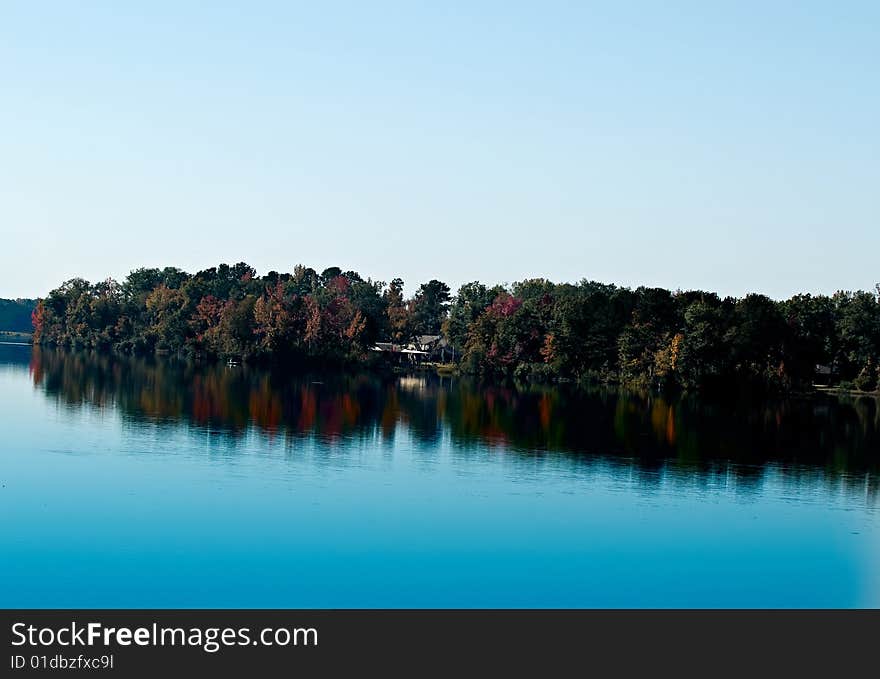 Blue water and fall foliage make this a seren scene. Blue water and fall foliage make this a seren scene.