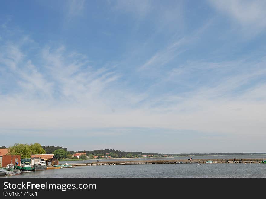 Blue sky over  sea and settlement