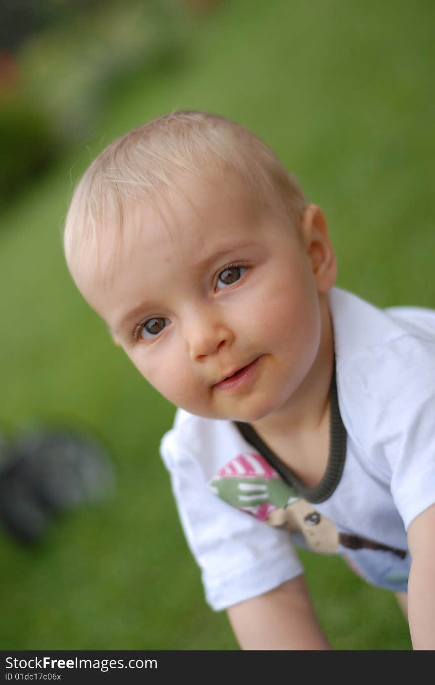 Beautiful little girl on  green grass. Beautiful little girl on  green grass