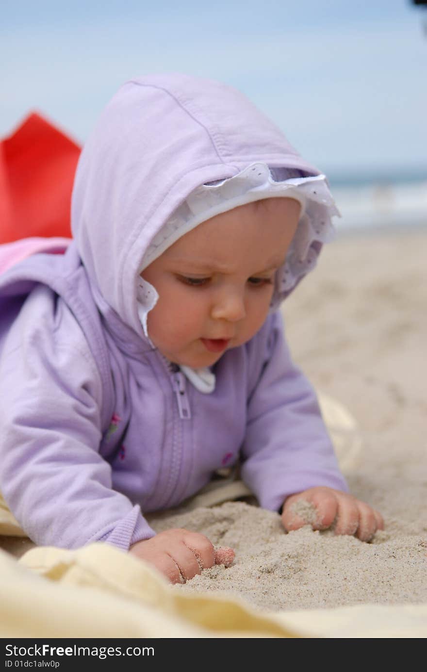 Child lies on sea sand. Child lies on sea sand