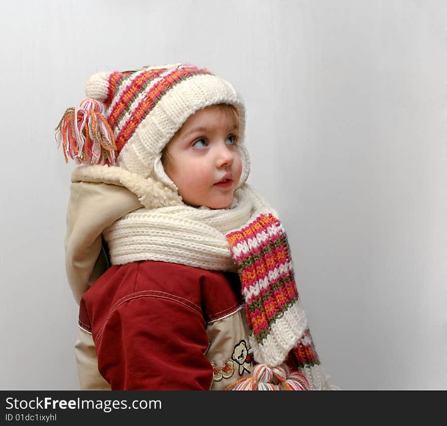 The little girl in winter clothes