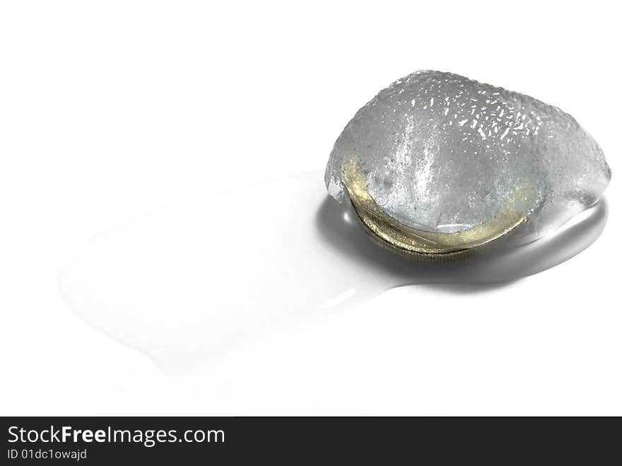 A coin inside a melting piece of ice. A coin inside a melting piece of ice