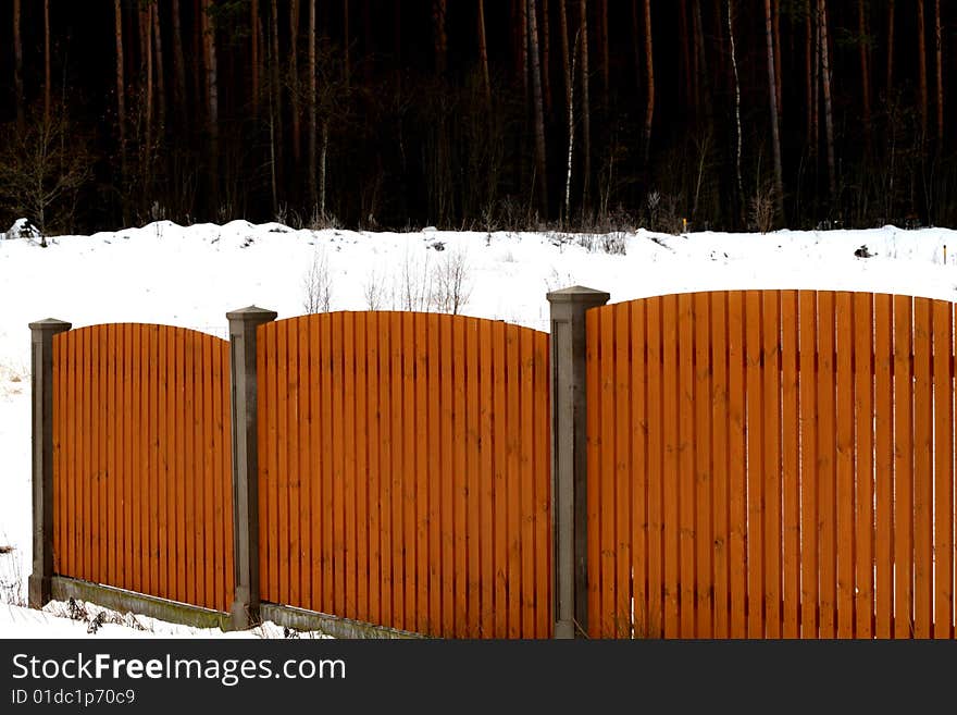 A wooden fence ,winter,snow