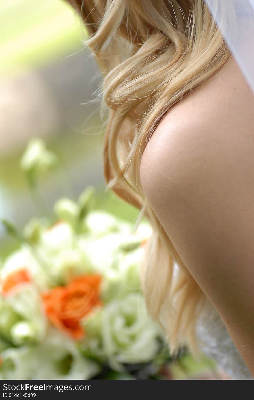 Bride holding  bouquet from roses