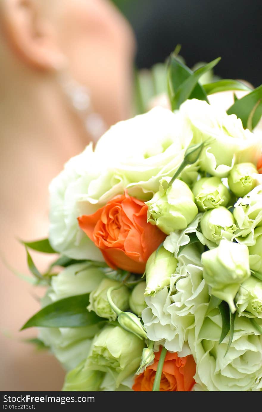 Bride holding  bouquet from roses