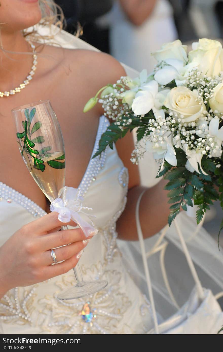 Bride wearing wedding dress and holding bouquet