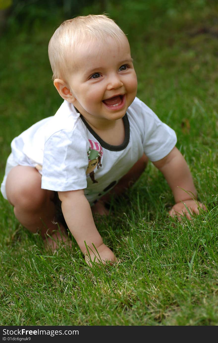 Beautiful little girl on  green grass. Beautiful little girl on  green grass