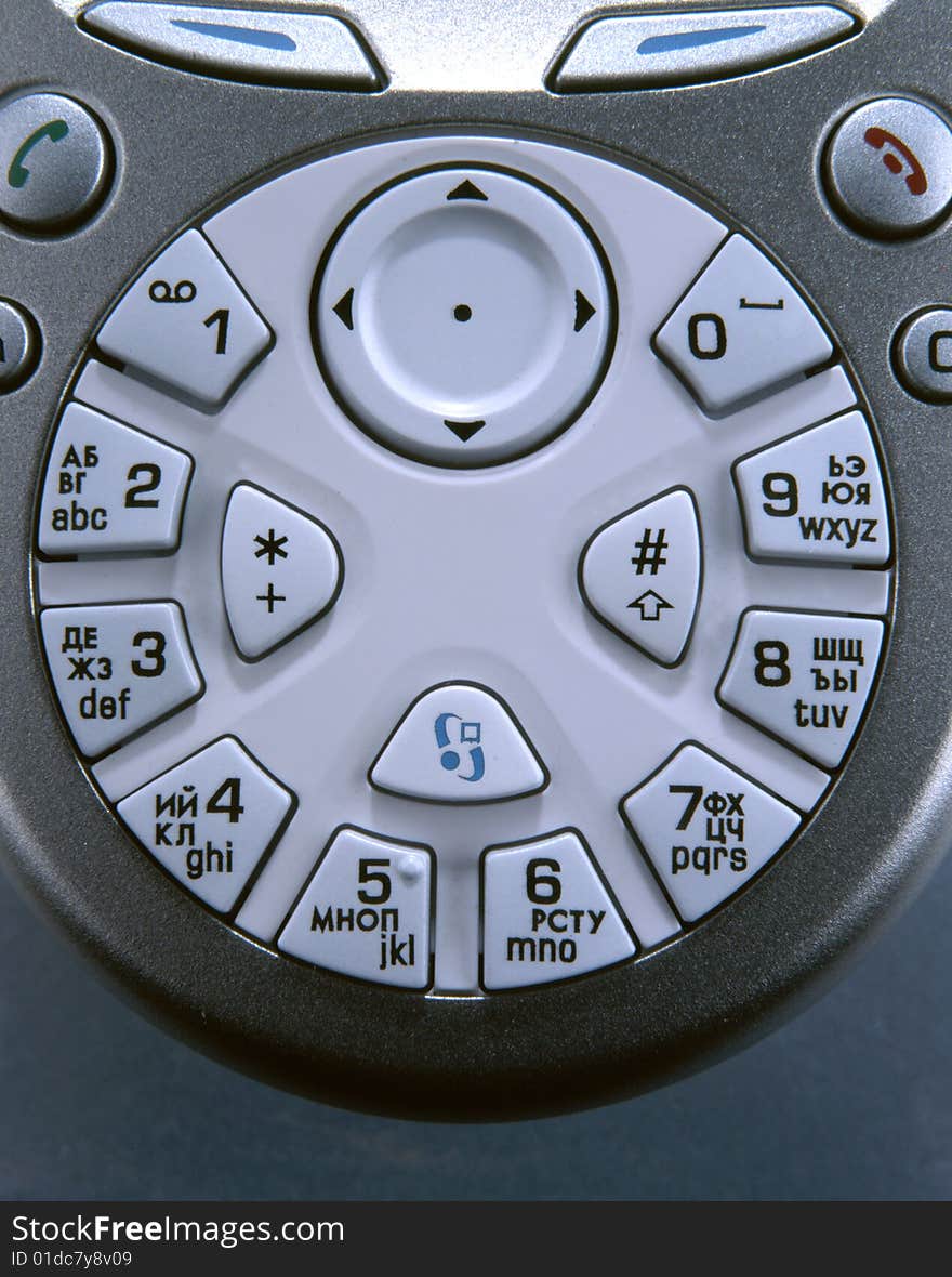 Round mobile phone keypad with a joystick