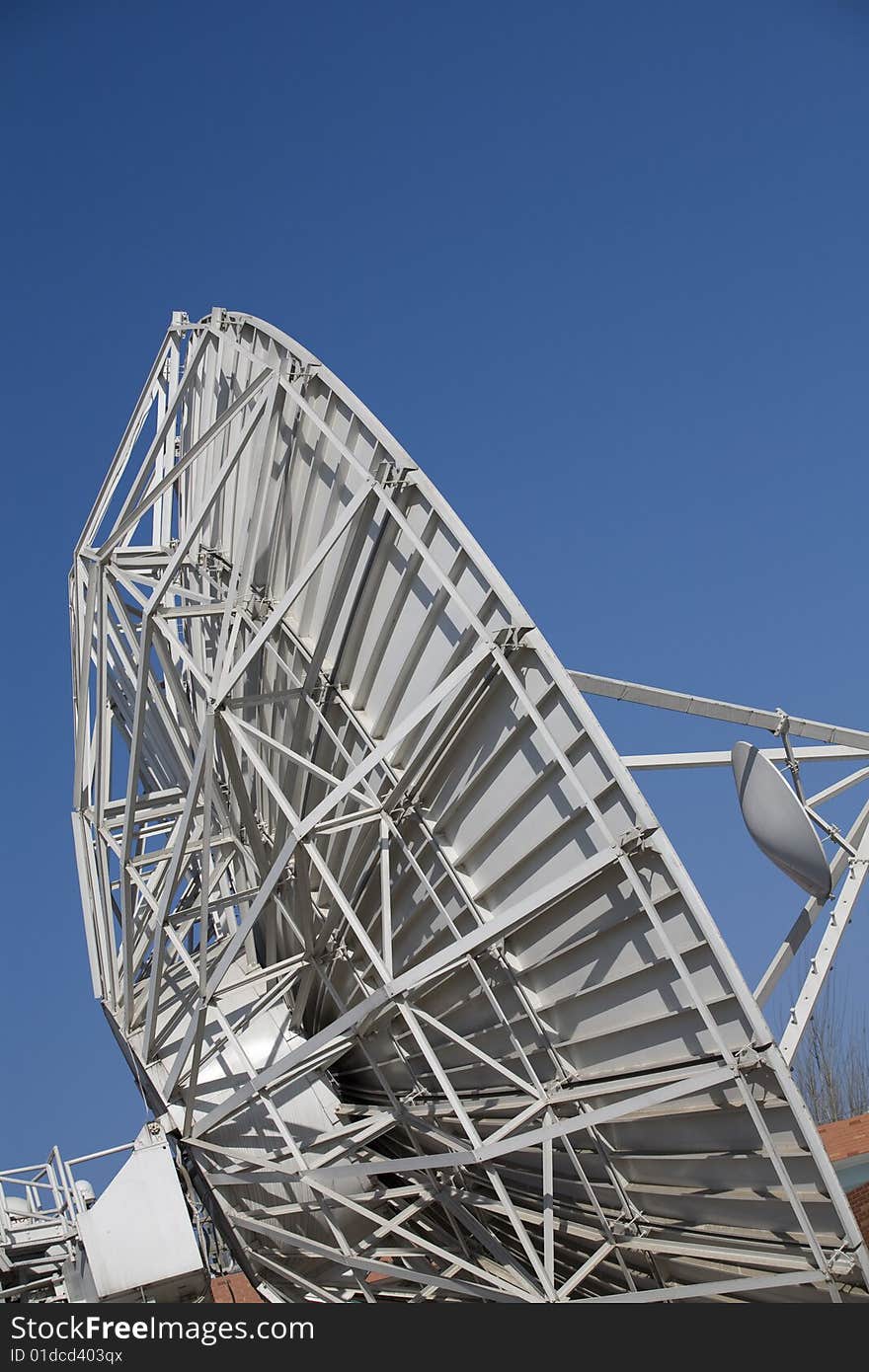 A large satellite dishes on blue sky