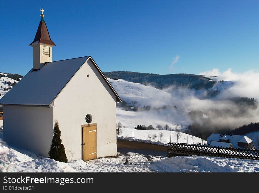 Little churche with snow and fog at darck forest in germany. Little churche with snow and fog at darck forest in germany