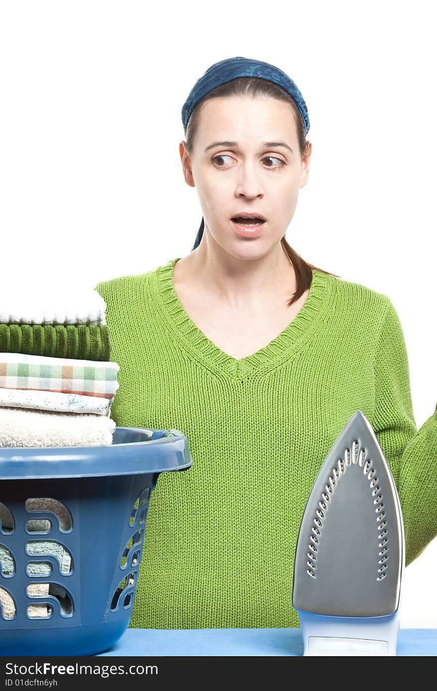 A woman in a domestic setting ready to tackle ironing on a white background. A woman in a domestic setting ready to tackle ironing on a white background