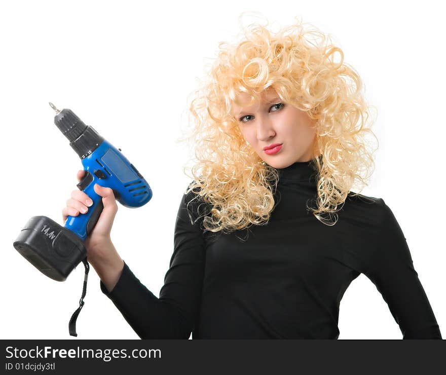 Young beautiful girl with a drill in the hands. Young beautiful girl with a drill in the hands